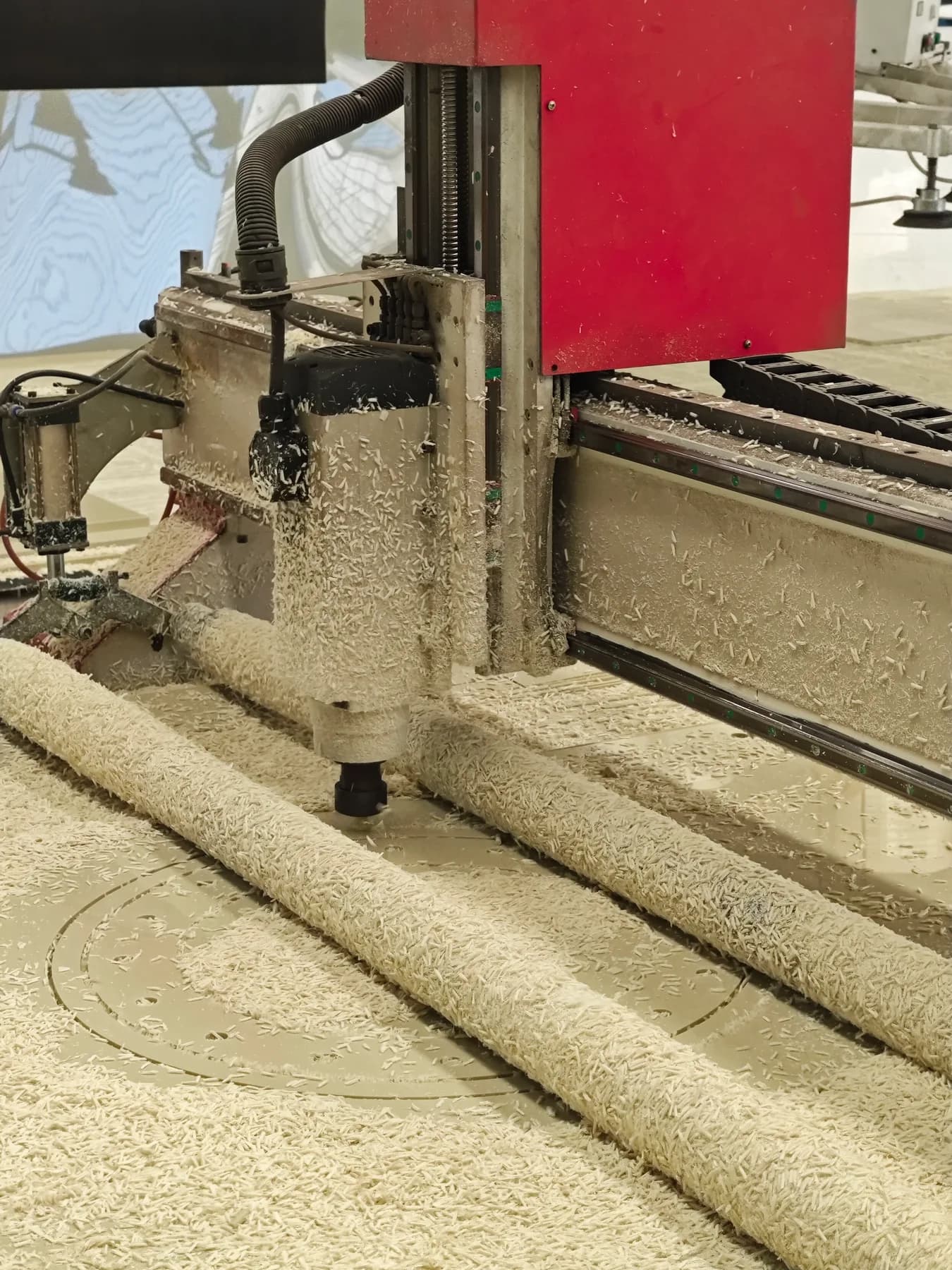 Router machining a plastic sheet at Xin Longdi