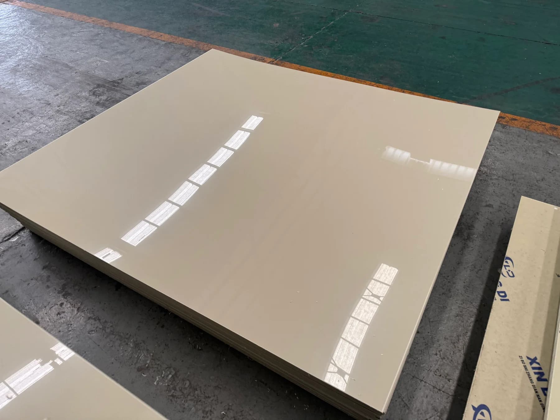 Finished PP sheets stacked on the Xin Longdi workshop floor