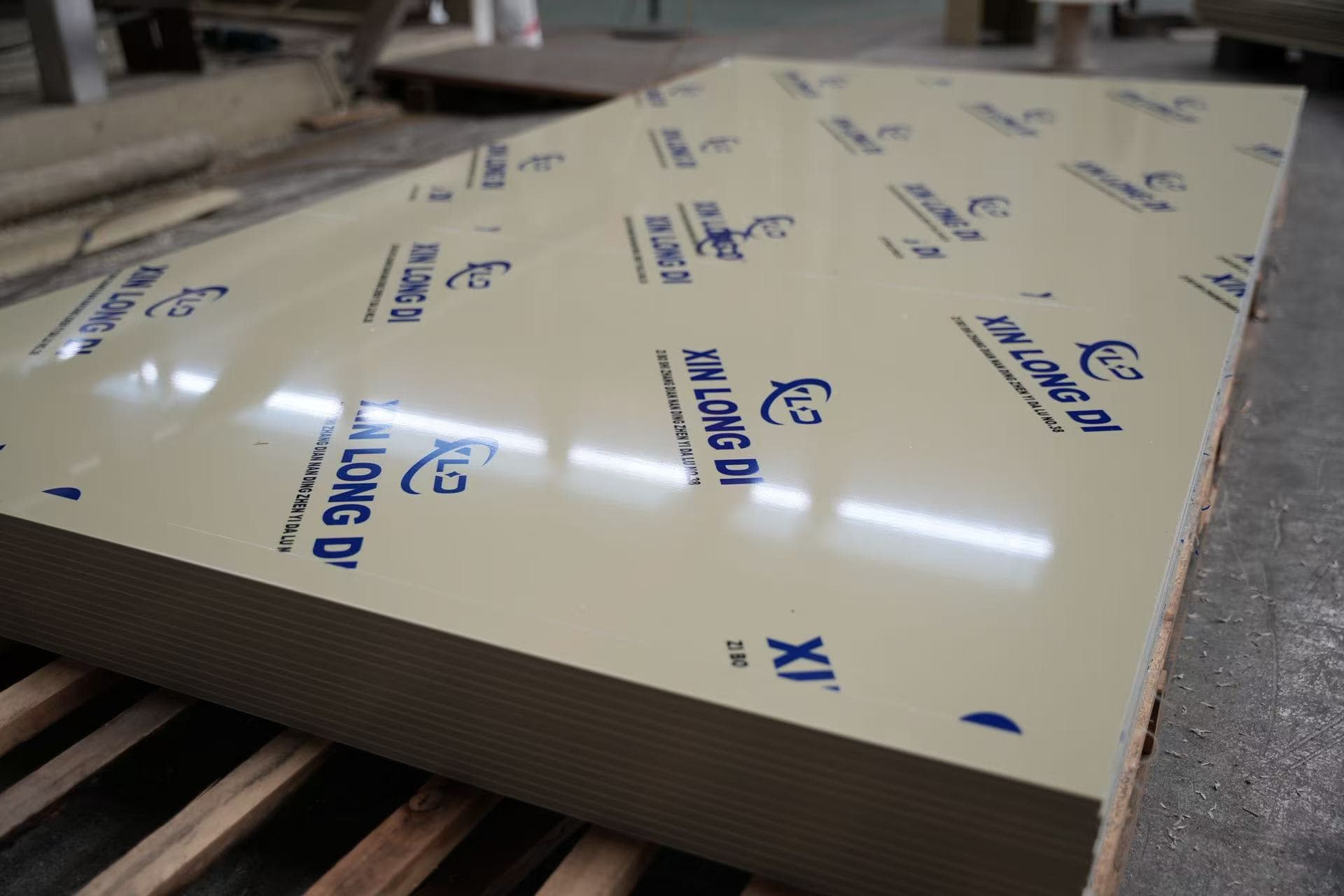 Stacked plastic sheets with Xin Longdi branded protective film